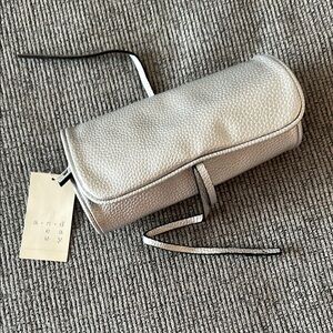 Metallic silver jewelry roll